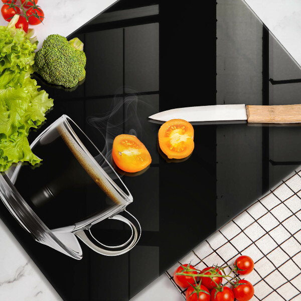 Skärbräda i glas Ett glas varmt kaffe