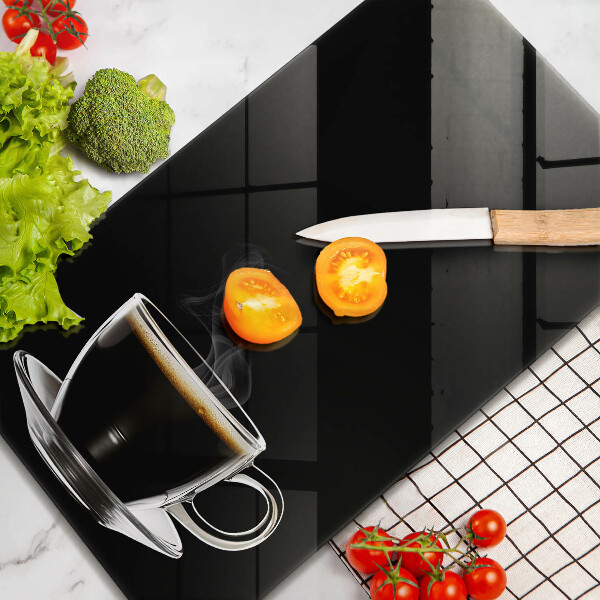 Skärbräda i glas Ett glas varmt kaffe