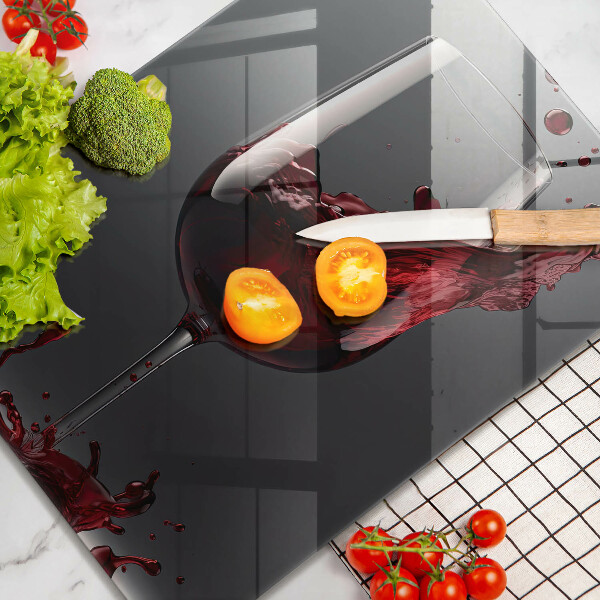 Skärbräda i glas Rött vin i ett glas