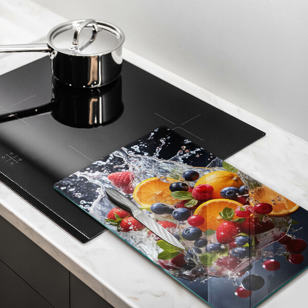 Skärbräda i glas Frukt i vatten