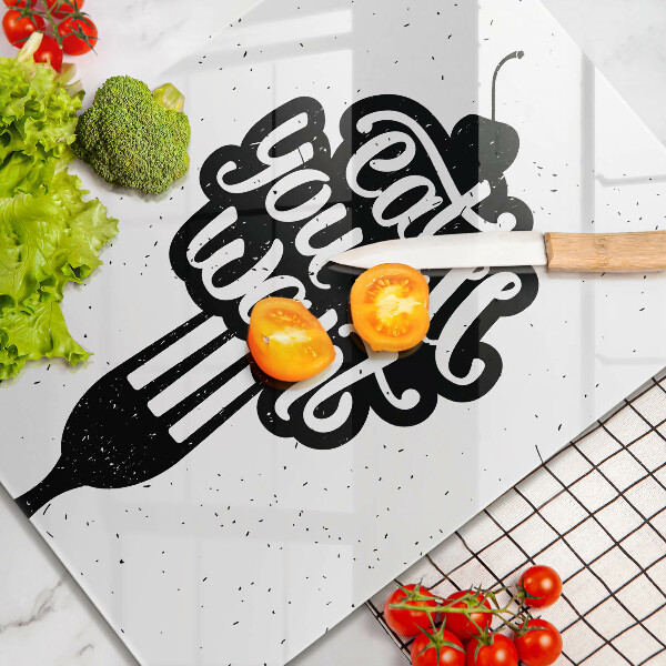 Skärbräda i glas Inskriptionen Ät alla vill ha