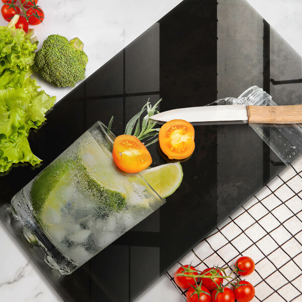 Skärbräda i glas Ett glas vatten