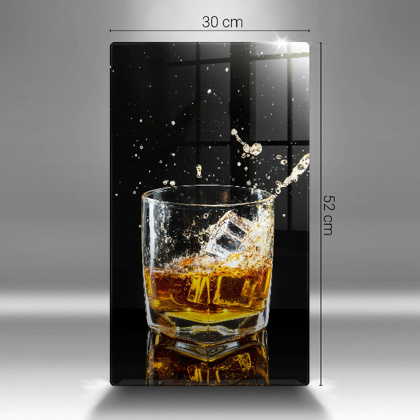 Skärbräda i glas Ett glas whisky