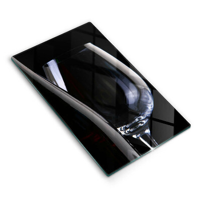 Skärbräda i glas Ett glas och en flaska