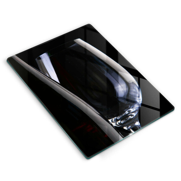 Skärbräda i glas Ett glas och en flaska