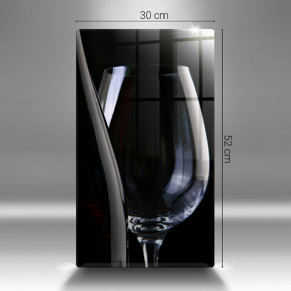 Skärbräda i glas Ett glas och en flaska