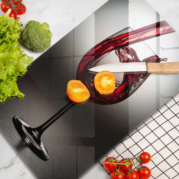 Skärbräda i glas Ett glas och rött vin