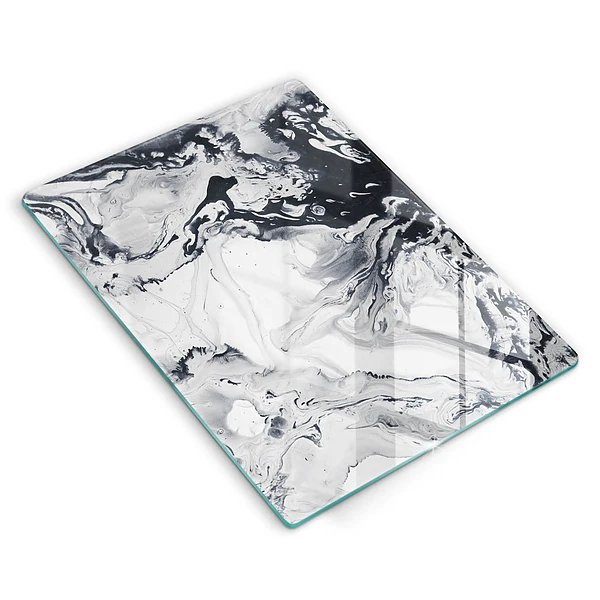 Glasskärbräda med bläckabstraktion