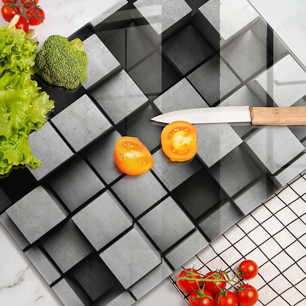 Glasskärbräda med abstrakt 3D-motiv av rutor