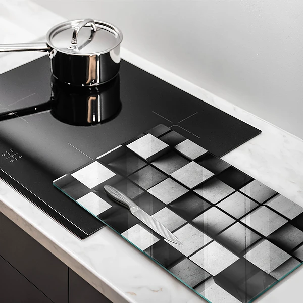 Glasskärbräda med abstrakt 3D-motiv av rutor
