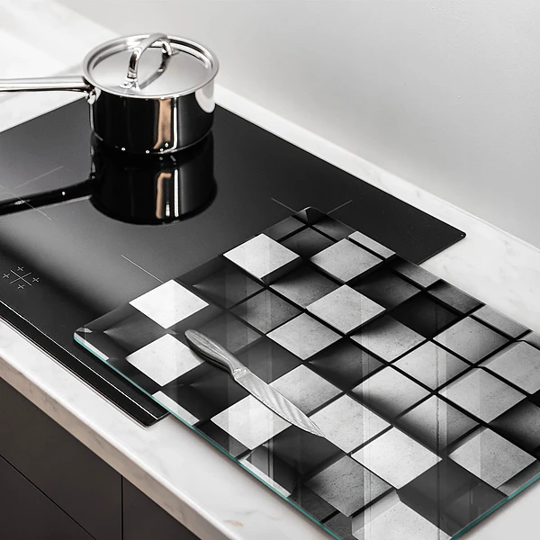 Glasskärbräda med abstrakt 3D-motiv av rutor