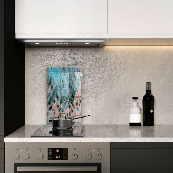 Glasskärbräda med motiv av boho-fågelfjädrar