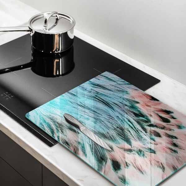 Glasskärbräda med motiv av boho-fågelfjädrar
