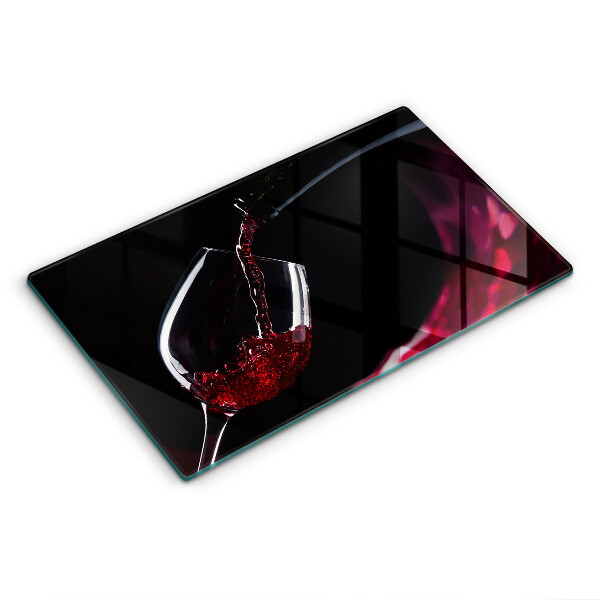 Skärbräda i härdat glas Ett glas rött vin