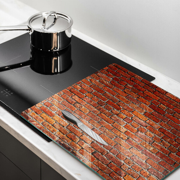 Skärbräda av glas Tegelvägg