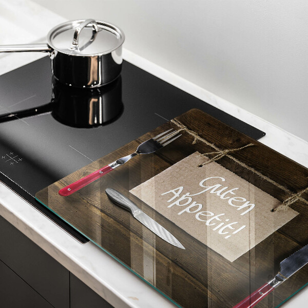 Skärbräda av glas På brädorna står det Guten Apetit
