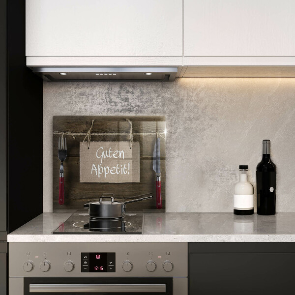 Skärbräda av glas På brädorna står det Guten Apetit