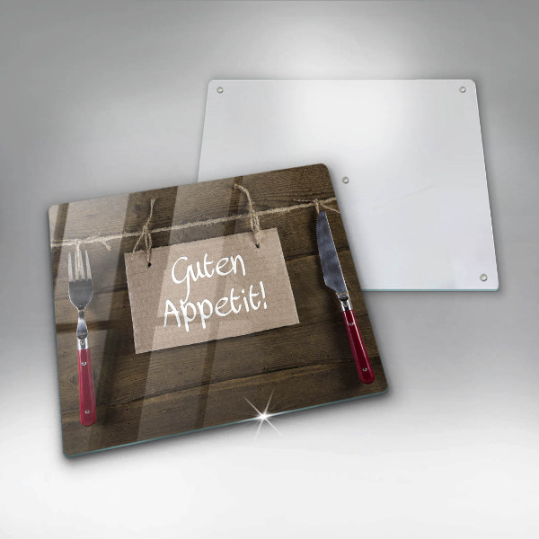 Skärbräda av glas På brädorna står det Guten Apetit
