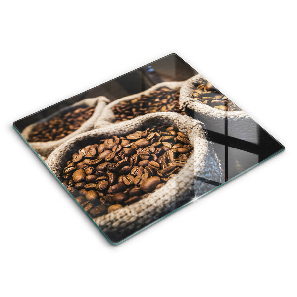 Skärbräda av glas Påsar med kaffebönor