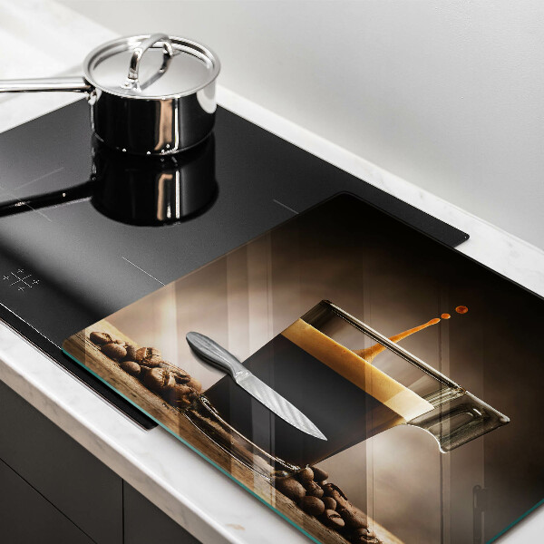 Skärbräda av glas Glas och kaffebönor