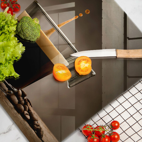 Skärbräda av glas Glas och kaffebönor