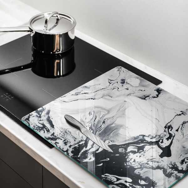 Skärbräda av glas Bläckabstraktion