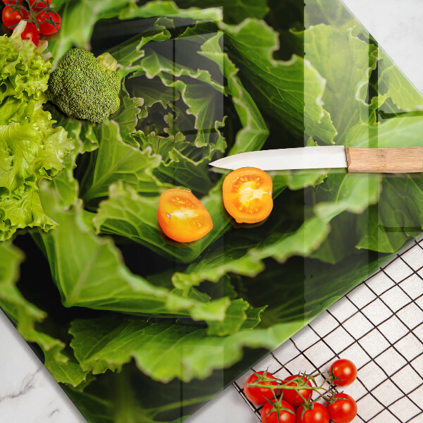 Skärbräda av glas Äter salladsblad