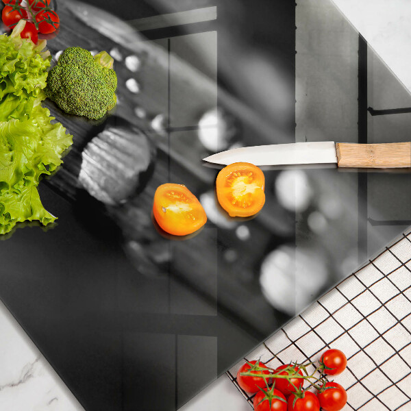 Skärbräda av glas Daggdroppar på löv