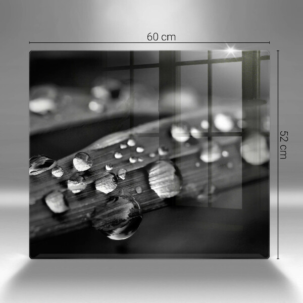 Skärbräda av glas Daggdroppar på löv