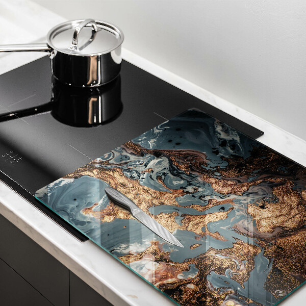 Skärbräda av glas Gyllene stenstruktur