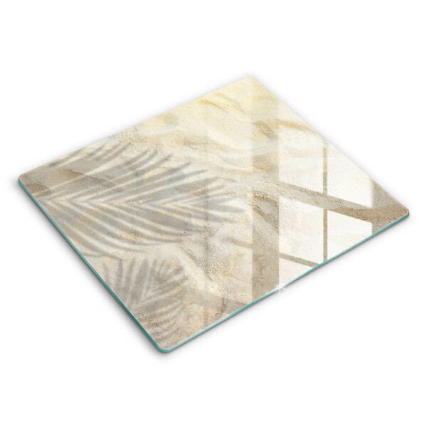 Skärbräda av glas Palmblad och sand