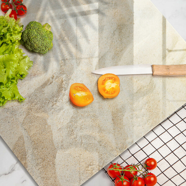 Skärbräda av glas Palmblad och sand