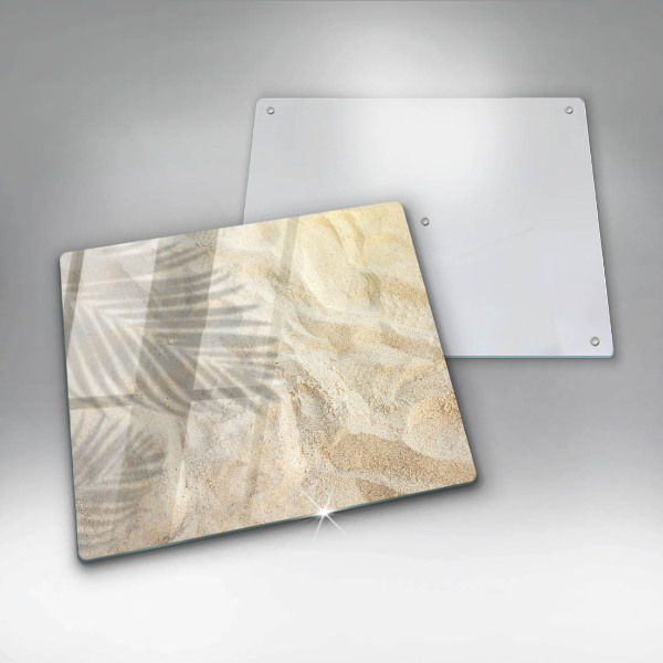 Skärbräda av glas Palmblad och sand