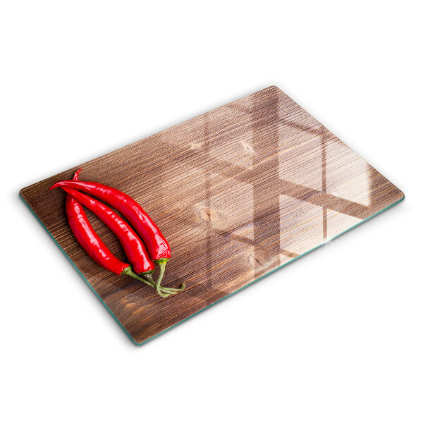 Skärbräda glas modern Chilipeppar på trä