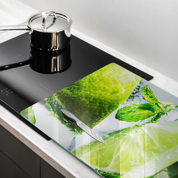 Skärbräda glas modern Vatten med lime och is