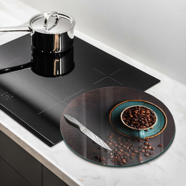 Skärbräda glas unik En kopp kaffebönor