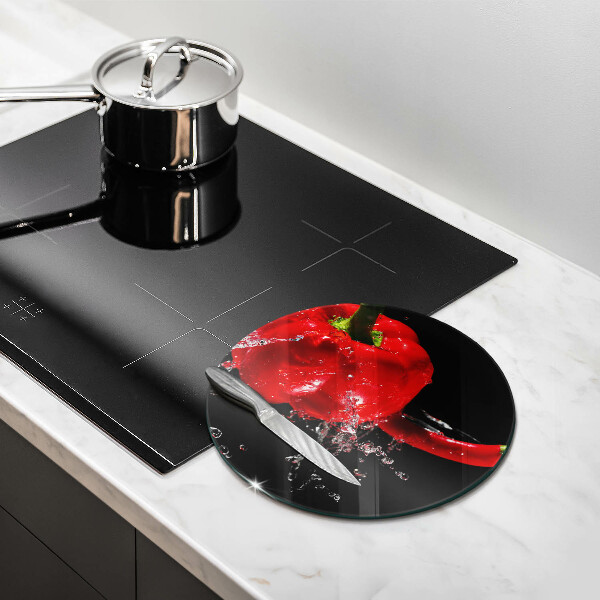 Skärbräda glas unik Röd paprika i vatten