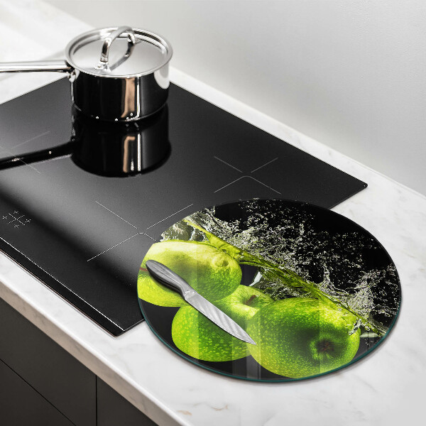 Skärbräda glas unik Gröna äpplen och vatten