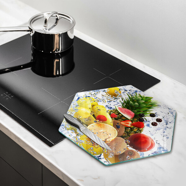 Skärbräda glas sexhörning Saftig frukt och vatten