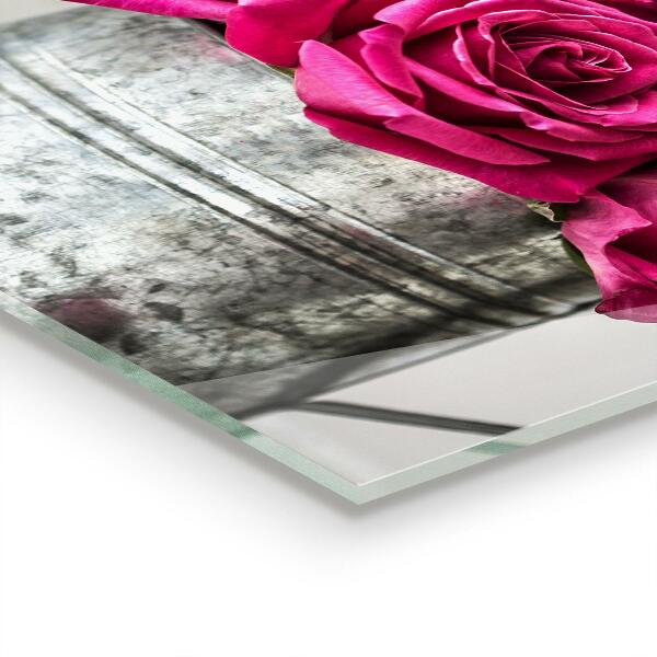 Stänkskydd kök Vattenkanna med en bukett rosor