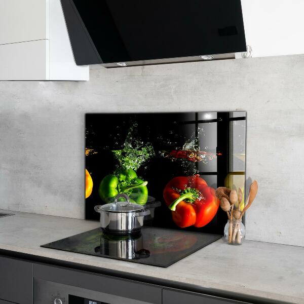 Stänkskydd kök Färgglada paprika under vatten