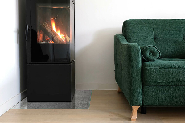 Kvadratisk glasskiva under kamin Rå betongstruktur