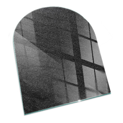 Halvoval glasskiva framför öppen spis Stenytans struktur