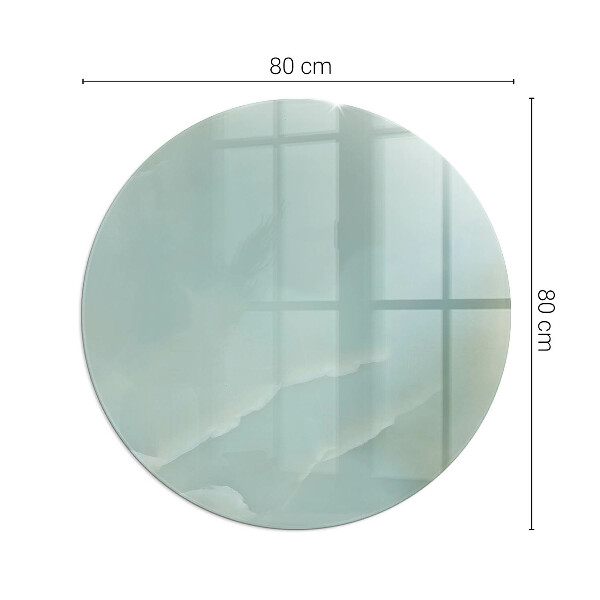Runda glasskiva framför öppen spis Delikat marmormönster