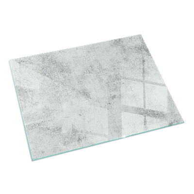 Rektangulär glasskiva framför öppen spis Rå betongstruktur