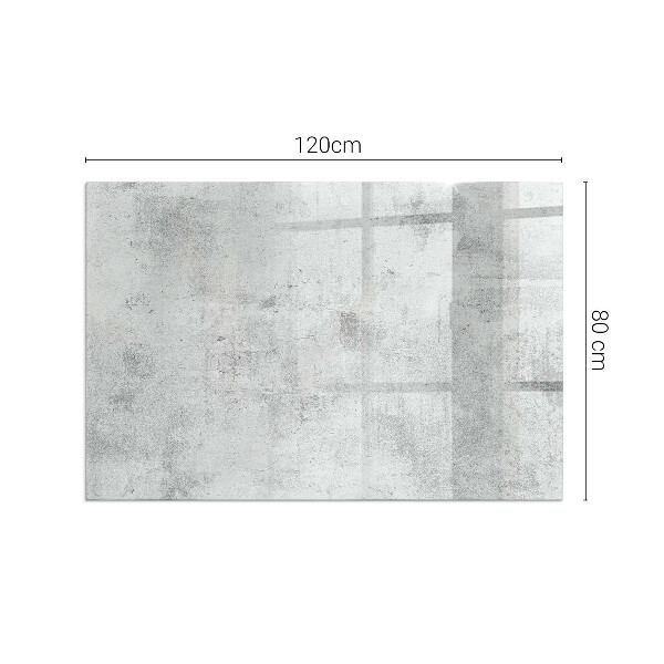 Rektangulär glasskiva framför öppen spis Rå betongstruktur