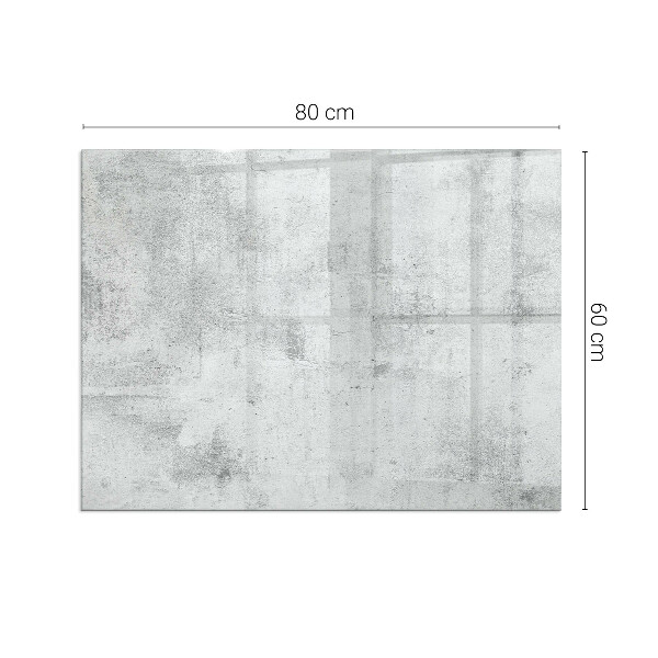 Rektangulär glasskiva framför öppen spis Rå betongstruktur